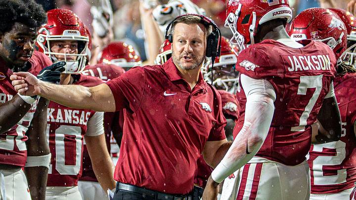Arkansas Razorbacks coach Ryan Silverfield (left) talks to his quarterback KJ Jackson (right) during first half against Tulsa. Arkansas Razorbacks coach Ryan Silverfield (left) talks to his quarterback KJ Jackson (right) during first half against Tulsa.