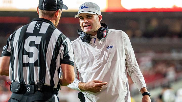 Tulsa Golden Hurricane coach Tre Lamb speaks with an official during game against Arkansas in Razorback Stadium. Tulsa Golden Hurricane coach Tre Lamb speaks with an official during game against Arkansas in Razorback Stadium.