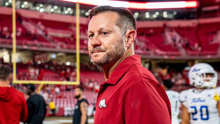Arkansas Razorbacks coach Ryan Silverfield celebrates following a 34-6 victory over Tulsa.