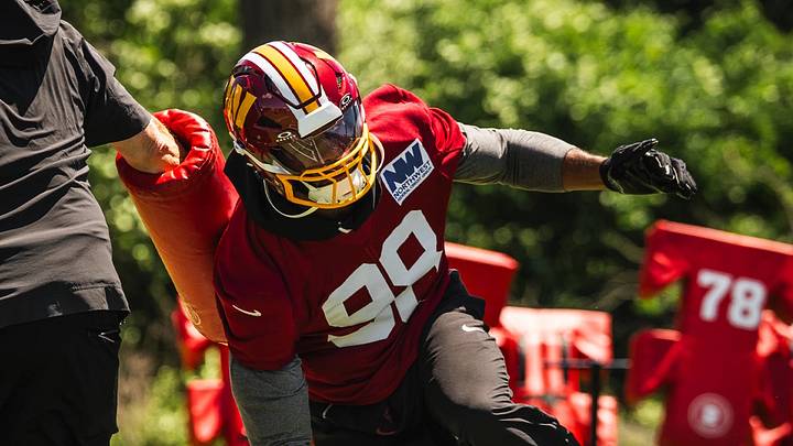 Validating the investment: Commanders' $96 million offseason acquisition Odafe Oweh (#98) works on his striking technique and pad level during a recent training camp drill. Validating the investment: Commanders' $96 million offseason acquisition Odafe Oweh (#98) works on his striking technique and pad level during a recent training camp drill.