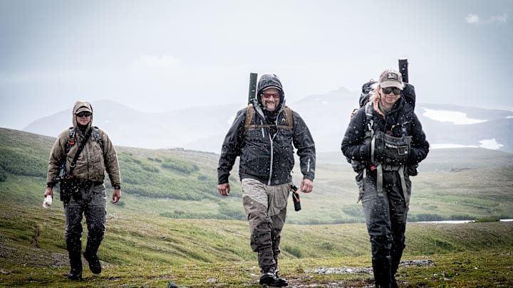 Alaskan guide and lodge owner Skylar Lamont leading her clients on a long hike to the river. Alaskan guide and lodge owner Skylar Lamont leading her clients on a long hike to the river.