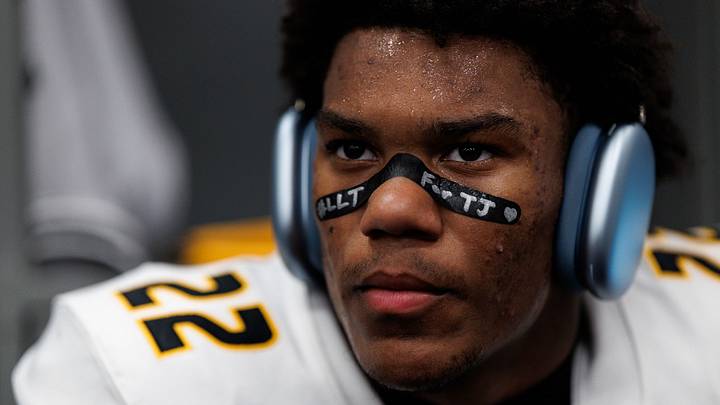 Missouri safety Elijah Dotson (22) sits in the locker room before Missouri's game against Kansas on Sept. 11 at David Booth Kansas Memorial Stadium. Dotson writes "#LLT" and "For TJ" on his eye black every game. 