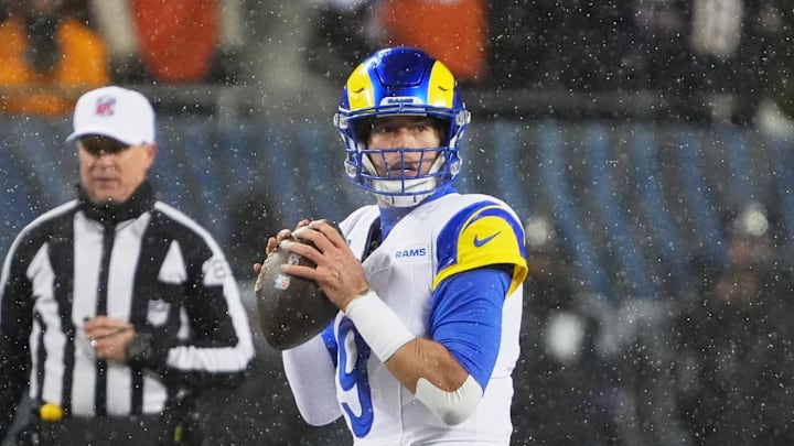 Jan 18, 2026; Chicago, IL, USA; Los Angeles Rams quarterback Matthew Stafford (9) looks to throw a pass against the Chicago Bears during the first quarter of an NFC Divisional Round game at Soldier Field. Mandatory Credit: David Banks-Imagn Images