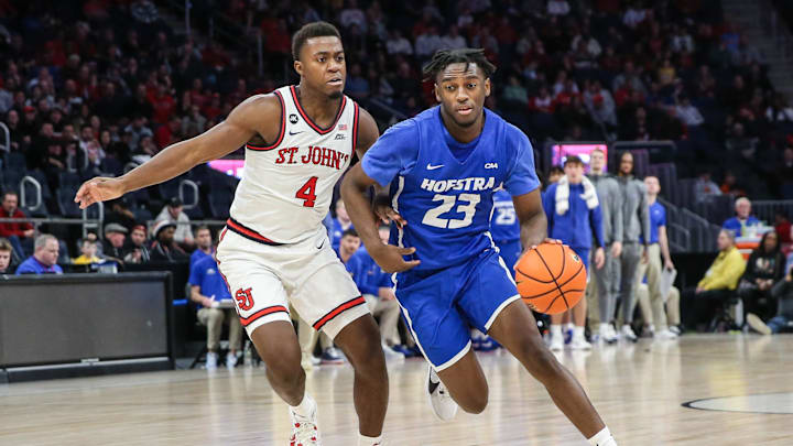 Dec 30, 2023; Elmont, New York, USA;  Hofstra Pride guard Tyler Thomas (23) drives to the rim against St. John's. 