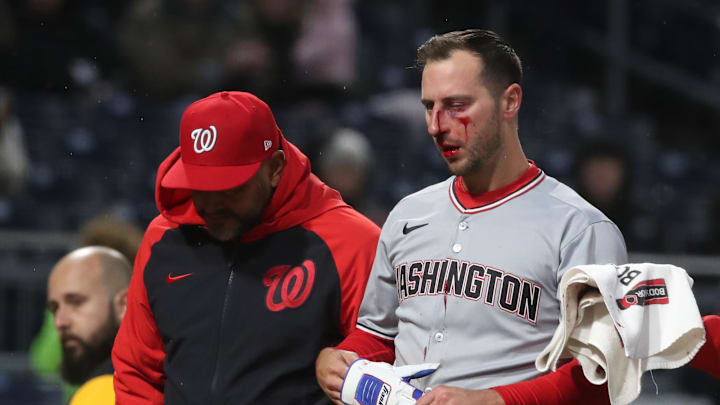 Pittsburgh, Pennsylvania, USA;  Washington Nationals third baseman Paul DeJong (14) leaves the field bloodied after being hit in the face by a Pittsburgh Pirates pitch during the sixth inning at PNC Park.