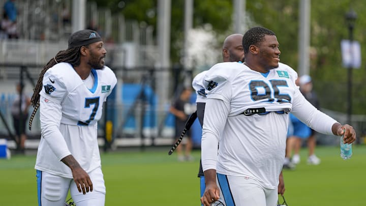 Jul 30, 2024; Charlotte, NC, USA; Carolina Panthers Derrick Brown (95) and linebacker Jadeveon Clowney (7) at Carolina Panthers Practice Fields. 