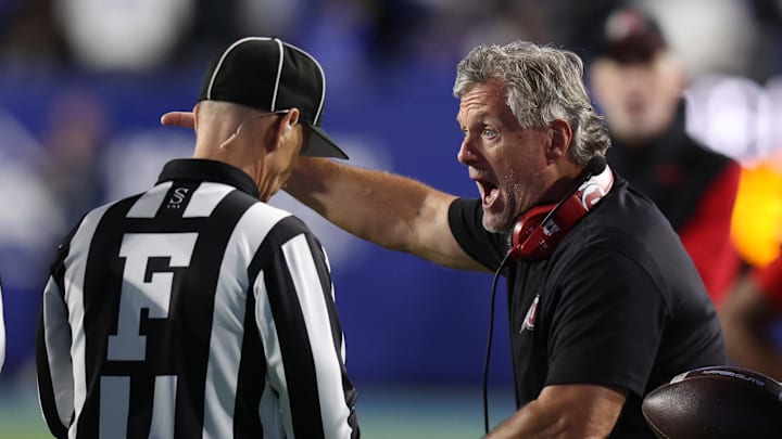 Utah Utes head coach Kyle Whittingham (right) argues a call with field judge Matt Mills during the second half of a game against the Utah Utes at LaVell Edwards Stadium.