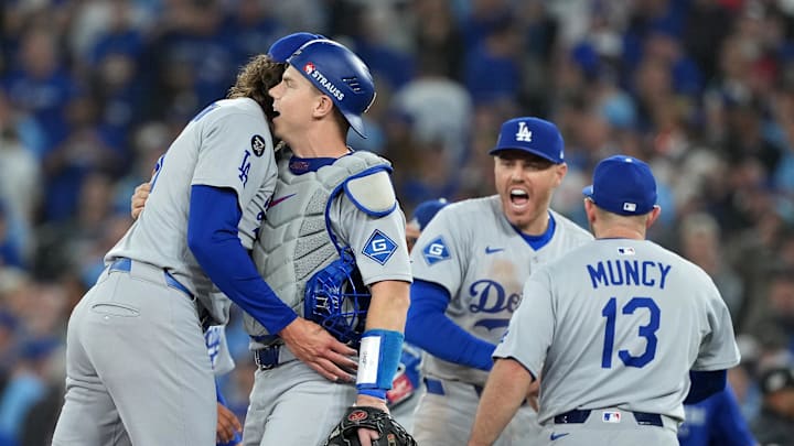 Oct 31, 2025; Toronto, Ontario, CAN; Los Angeles Dodgers pitcher Tyler Glasnow (31) reacts with catcher Will Smith (16) after the ninth inning for game six of the 2025 MLB World Series at Rogers Centre. Mandatory Credit: Nick Turchiaro-Imagn Images