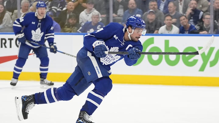 Oct 21, 2024; Toronto, Ontario, CAN; Toronto Maple Leafs forward Auston Matthews (34) shoots the puck against the Tampa Bay Lightning during the third period at Scotiabank Arena. Mandatory Credit: John E. Sokolowski-Imagn Images