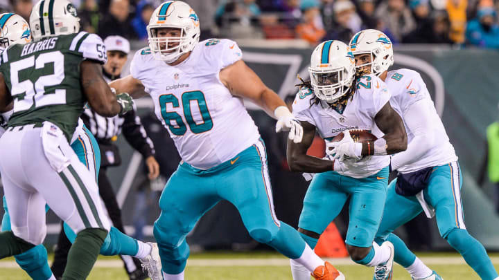 Guard Kraig Urbik (60) blocks for running back Jay Ajayi (23) during a late-season victory at MetLife Stadium in 2016. Guard Kraig Urbik (60) blocks for running back Jay Ajayi (23) during a late-season victory at MetLife Stadium in 2016.