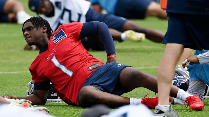 Tennessee Titans quarterback Cam Ward stretches during an NFL football minicamp camp practice. Tennessee Titans quarterback Cam Ward stretches during an NFL football minicamp camp practice.