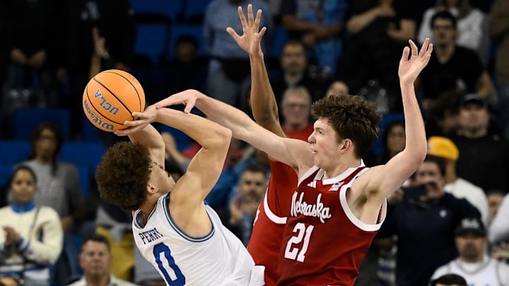 Nebraska forward Pryce Sandfort fouls UCLA guard Trent Perry during the second half at Pauley Pavilion. Nebraska forward Pryce Sandfort fouls UCLA guard Trent Perry during the second half at Pauley Pavilion.