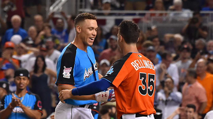 National League outfielder Cody Bellinger of the Los Angeles Dodgers greets American League outfielder Aaron Judge of the New York Yankees after the second round during the 2017 MLB Home Run Derby at Marlins Park on July 10, 2017. 