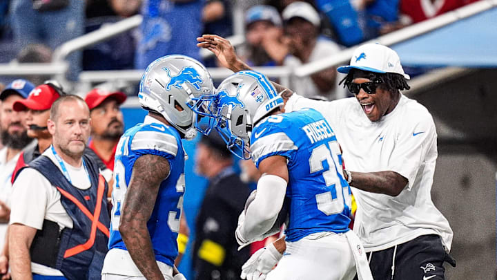 Detroit Lions cornerback Tyson Russell (35) celebrates an interception against Houston Texans with cornerback Nick Whiteside (38) and wide receiver Jameson Williams (1) during the second half at Ford Field in Detroit on Saturday, August 23, 2025.