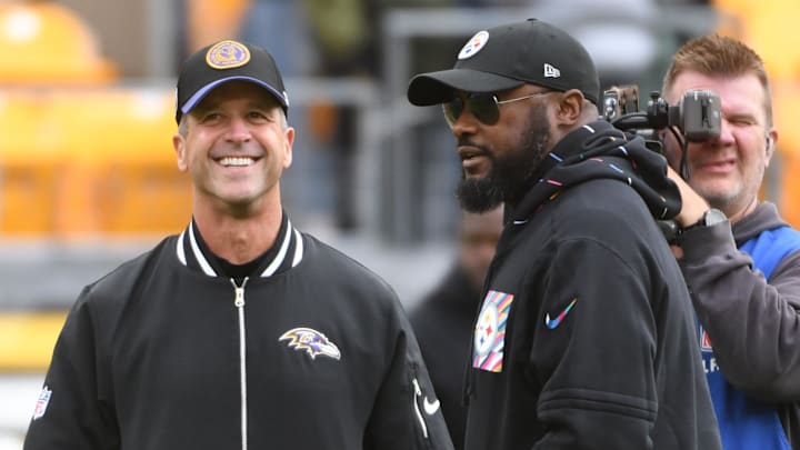 Oct 8, 2023; Pittsburgh, Pennsylvania, USA; Baltimore Ravens head coach John Harbaugh (left) and Pittsburgh Steelers head coach Mike Tomlin meet at mid-field before their game at Acrisure Stadium. Mandatory Credit: Philip G. Pavely-Imagn Images