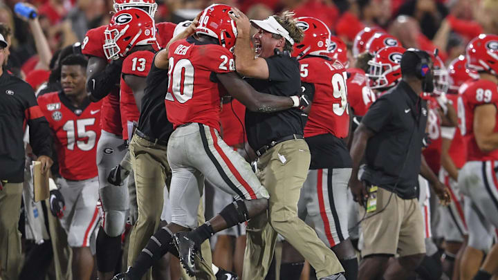 Sep 21, 2019; Athens, GA, USA; Georgia Bulldogs defensive back J.R. Reed (20) reacts with head coach Kirby Smart reacts after intercepting a pass against the Notre Dame Fighting Irish during the second half at Sanford Stadium. Mandatory Credit: Dale Zanine-Imagn Images Sep 21, 2019; Athens, GA, USA; Georgia Bulldogs defensive back J.R. Reed (20) reacts with head coach Kirby Smart reacts after intercepting a pass against the Notre Dame Fighting Irish during the second half at Sanford Stadium. Mandatory Credit: Dale Zanine-Imagn Images