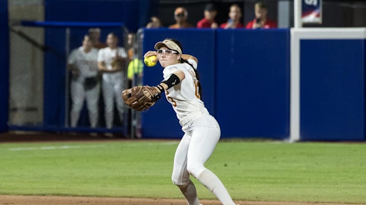 Jun 6, 2025; Oklahoma City, OK, USA;  Texas Longhorns utility Leighann Goode (43) throws to first to make the final out in the game in the seventh inning against the Texas Tech Red Raiders to win the National Championship 10-4 in game three of the NCAA Softball Women's College World Series finals at Devon Park. Mandatory Credit: Brett Rojo-Imagn Images