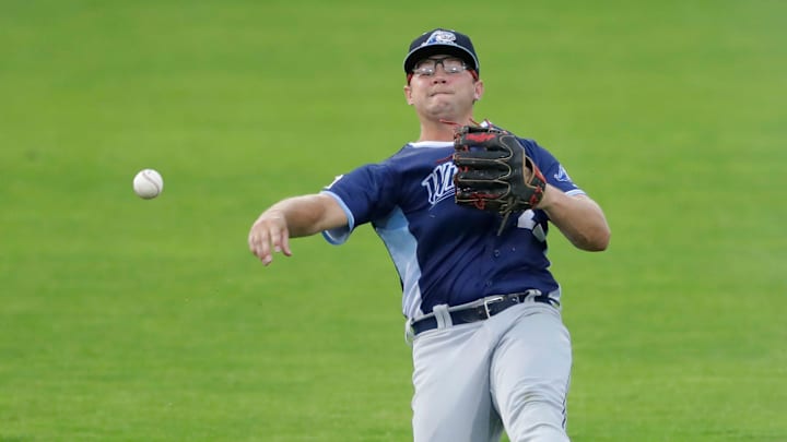 West Michigan Whitecaps' Max Anderson (22) throws to first base against the Wisconsin Timber Rattlers Tuesday, July 9, 2024, at Neuroscience Group Field at Fox Cities Stadium in Grand Chute, Wisconsin. The Timber Rattlers won 4-0.