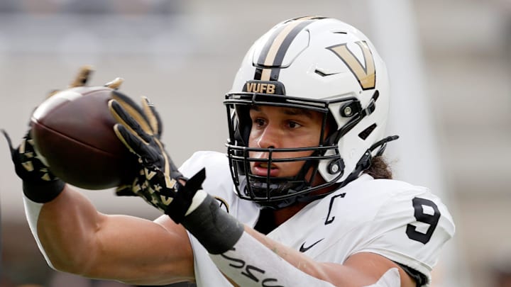 Vanderbilt tight end Eli Stowers (9) makes a catch as he warms up before playing against Tennessee 