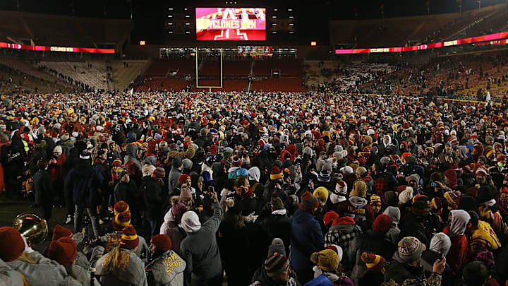 Iowa State fans rush to the field as Cyclones win 29-21 over Kansas State Wildcats in the NCAA football at Jack Trice Stadium on Saturday.