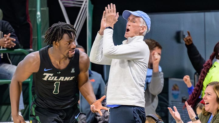 Jan 21, 2024; New Orleans, Louisiana, USA;  Tulane Green Wave guard Sion James (1) celebrates a three point basket with fans during the second half against the Memphis Tigers at Avron B. Fogelman Arena in Devlin Fieldhouse. Mandatory Credit: Matthew Hinton-Imagn Images