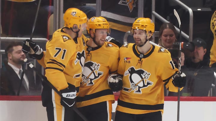 Jan 29, 2026; Pittsburgh, Pennsylvania, USA;  Pittsburgh Penguins center Evgeni Malkin (71) and center Tommy Novak (18) congratulate right wing Egor Chinakhov (middle) on his goal against the Chicago Blackhawks during the second period at PPG Paints Arena. Mandatory Credit: Charles LeClaire-Imagn Images