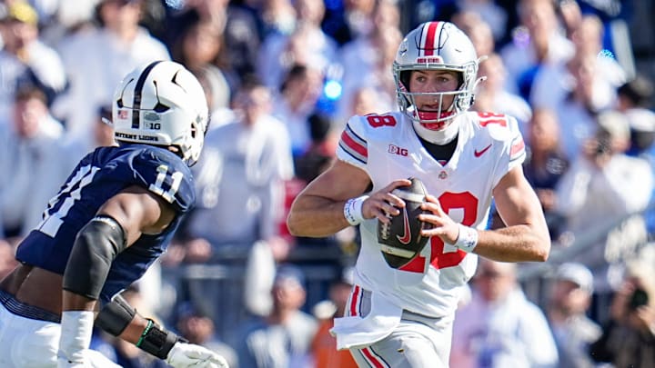 Ohio State Buckeyes quarterback Will Howard (18) looks to pass over Penn State Nittany Lions defensive end Abdul Carter (11) during the NCAA football game at Beaver Stadium in University Park, Pa. on Monday, Nov. 4, 2024. Ohio State won 20-13.