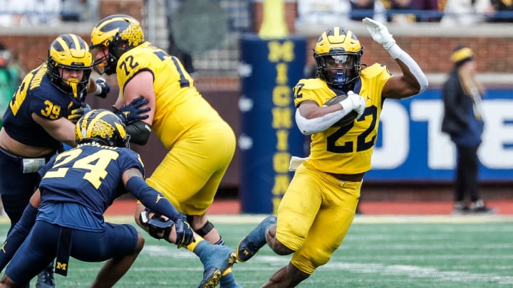 Maize Team running back Tavierre Dunlap (22) runs against Blue Team during the second half of the spring game at Michigan Stadium in Ann Arbor on Saturday, April 20, 2024.