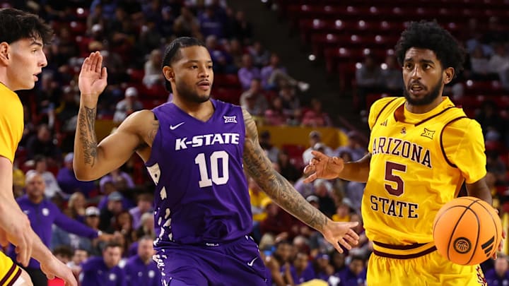 Jan 10, 2026; Tempe, Arizona, USA; Arizona State Sun Devils guard Maurice Odum (5) drives to the basket against Kansas State Wildcats guard David Castillo (10) in the second half at Desert Financial Arena. Mandatory Credit: Mark J. Rebilas-Imagn Images