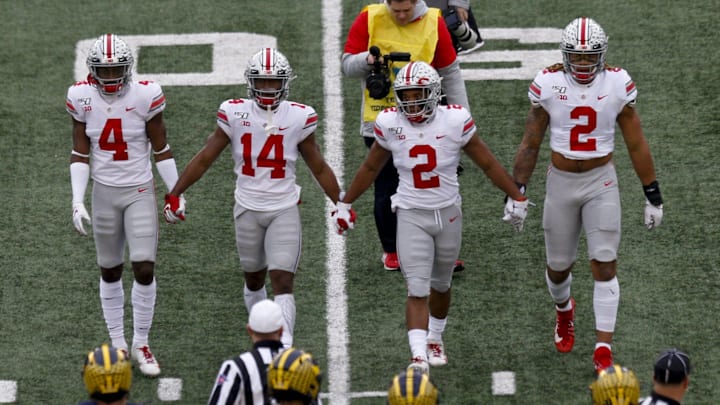 From left, Ohio State Buckeyes captains safety Jordan Fuller (4), wide receiver K.J. Hill Jr. (14), running back J.K. Dobbins (2) and defensive end Chase Young (2) walk to midfield for the coin toss before a NCAA Division I college football game between the Michigan Wolverines and the Ohio State Buckeyes on Saturday, November 30, 2019 at Michigan Stadium in Ann Arbor, Michigan. [Joshua A. Bickel/Dispatch]

Osu19um Jb Xtra 02