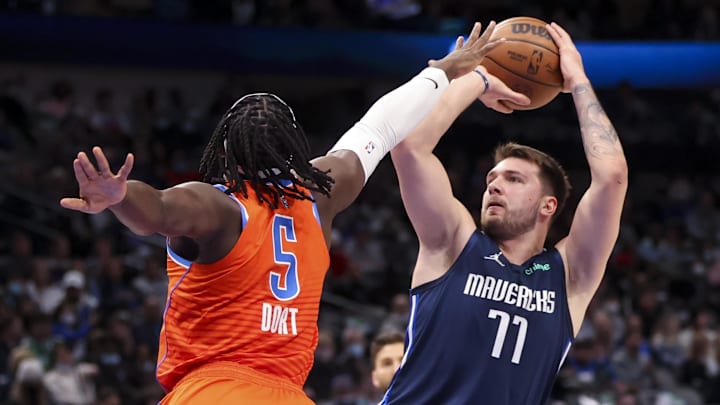 Jan 17, 2022; Dallas, Texas, USA;  Dallas Mavericks guard Luka Doncic (77) shoots over Oklahoma City Thunder's Lu Dort (5)