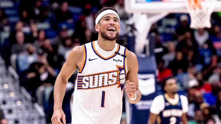 Dec 5, 2024; New Orleans, Louisiana, USA;  Phoenix Suns guard Devin Booker (1) reacts to having foul called against him against the New Orleans Pelicans during the second half  at Smoothie King Center. Mandatory Credit: Stephen Lew-Imagn Images