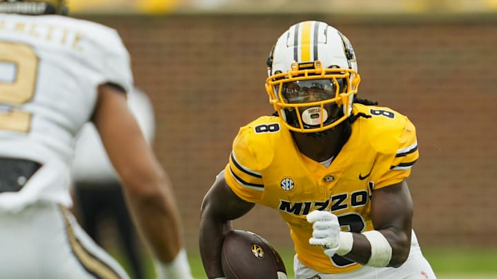 Sep 21, 2024; Columbia, Missouri, USA; Missouri Tigers running back Nate Noel (8) runs with the ball against Vanderbilt Commodores linebacker Randon Fontenette (2) during the first half at Faurot Field at Memorial Stadium. Mandatory Credit: Jay Biggerstaff-Imagn Images Sep 21, 2024; Columbia, Missouri, USA; Missouri Tigers running back Nate Noel (8) runs with the ball against Vanderbilt Commodores linebacker Randon Fontenette (2) during the first half at Faurot Field at Memorial Stadium. Mandatory Credit: Jay Biggerstaff-Imagn Images