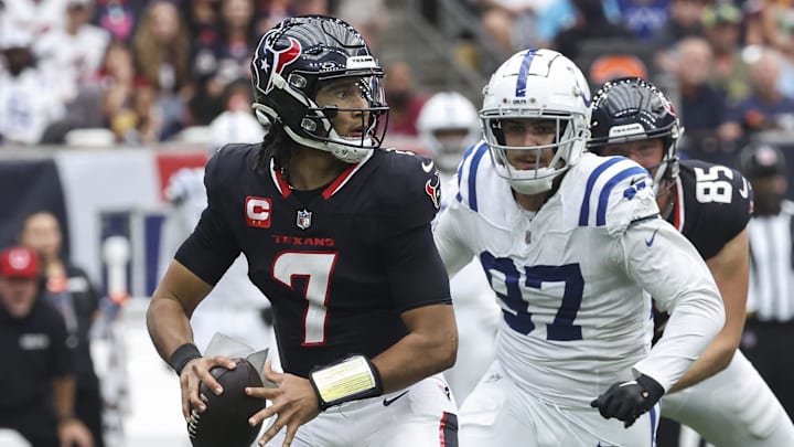 Oct 27, 2024; Houston, Texas, USA; Houston Texans quarterback C.J. Stroud (7) looks for an open receiver as Indianapolis Colts defensive end Laiatu Latu (97) applies defensive pressure during the game at NRG Stadium. Mandatory Credit: Troy Taormina-Imagn Images Oct 27, 2024; Houston, Texas, USA; Houston Texans quarterback C.J. Stroud (7) looks for an open receiver as Indianapolis Colts defensive end Laiatu Latu (97) applies defensive pressure during the game at NRG Stadium. Mandatory Credit: Troy Taormina-Imagn Images