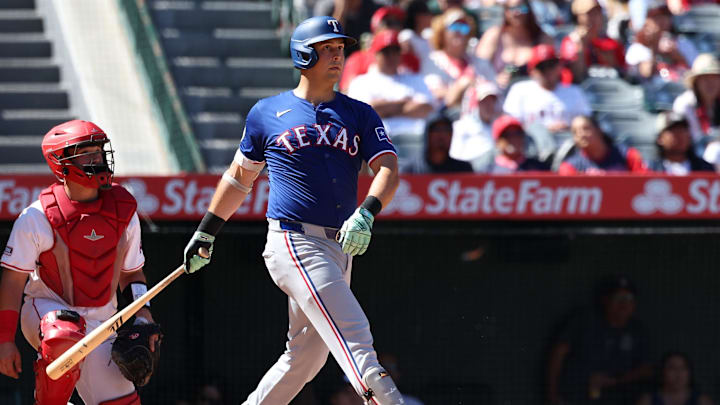 Sep 29, 2024; Anaheim, California, USA; Texas Rangers first baseman Nathaniel Lowe (30) hits a home run during the eighth inning against the Los Angeles Angels at Angel Stadium. Sep 29, 2024; Anaheim, California, USA; Texas Rangers first baseman Nathaniel Lowe (30) hits a home run during the eighth inning against the Los Angeles Angels at Angel Stadium.