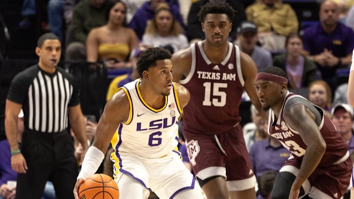 Jan 20, 2024; Baton Rouge, Louisiana, USA; LSU Tigers guard Jordan Wright (6) looks to pass the ball against Texas A&M Aggies guard Tyrece Radford (23) during the second half at Pete Maravich Assembly Center. Mandatory Credit: Stephen Lew-Imagn Images Jan 20, 2024; Baton Rouge, Louisiana, USA; LSU Tigers guard Jordan Wright (6) looks to pass the ball against Texas A&M Aggies guard Tyrece Radford (23) during the second half at Pete Maravich Assembly Center. Mandatory Credit: Stephen Lew-Imagn Images