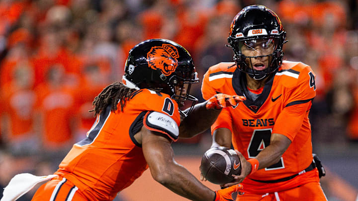 Oregon State quarterback Gevani McCoy hands off to running back Anthony Hankerson 