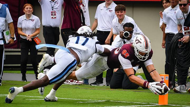 Sep 12, 2026; Blacksburg, Virginia, USA; Virginia Tech Hokies tight end Luke Reynolds (85) reaches for the end zone as Old Dominion Monarchs linebacker De'veion McLilley-Bulo (17) during the second quarter at Lane Stadium. Mandatory Credit: Brian Bishop-Imagn Images Sep 12, 2026; Blacksburg, Virginia, USA; Virginia Tech Hokies tight end Luke Reynolds (85) reaches for the end zone as Old Dominion Monarchs linebacker De'veion McLilley-Bulo (17) during the second quarter at Lane Stadium. Mandatory Credit: Brian Bishop-Imagn Images