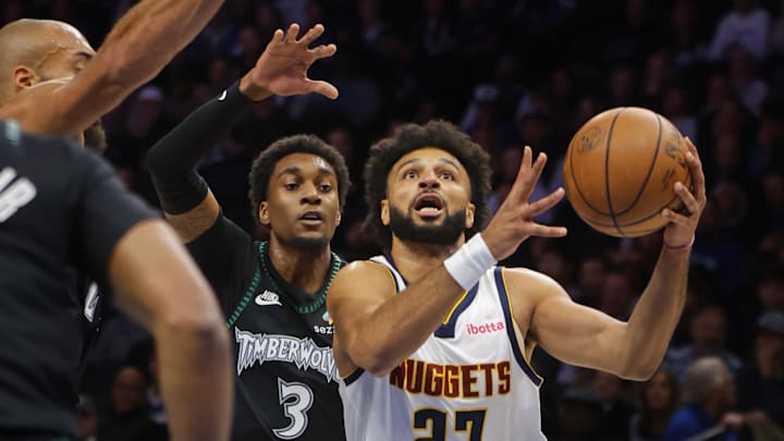 Oct 27, 2025; Minneapolis, Minnesota, USA; Denver Nuggets guard Jamal Murray (27) goes to the basket past Minnesota Timberwolves forward Jaden McDaniels (3) in the first quarter at Target Center. Mandatory Credit: Bruce Kluckhohn-Imagn Images Oct 27, 2025; Minneapolis, Minnesota, USA; Denver Nuggets guard Jamal Murray (27) goes to the basket past Minnesota Timberwolves forward Jaden McDaniels (3) in the first quarter at Target Center. Mandatory Credit: Bruce Kluckhohn-Imagn Images