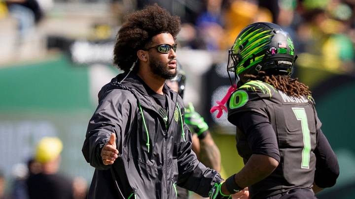 Oregon quarterback Dante Moore, left, greets Oregon wide receiver Dakorien Moore as the Oregon Ducks host the UCLA Bruins on Oct. 10, 2026, at Autzen Stadium in Eugene, Oregon. Oregon quarterback Dante Moore, left, greets Oregon wide receiver Dakorien Moore as the Oregon Ducks host the UCLA Bruins on Oct. 10, 2026, at Autzen Stadium in Eugene, Oregon.