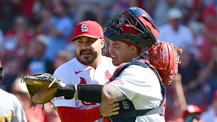 Aug 28, 2025; St. Louis, Missouri, USA; St. Louis Cardinals pitcher JoJo Romero (59) and catcher Yohel Pozo (63) hug after the St. Louis Cardinals defeated the Pittsburgh Pirates at Busch Stadium. Mandatory Credit: Tim Vizer-Imagn Images