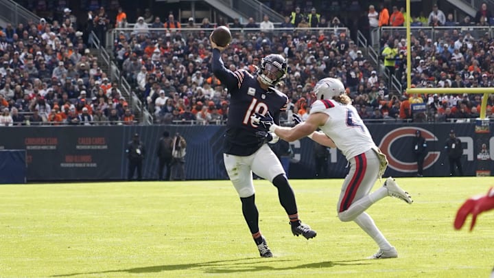 Nov 10, 2024; Chicago, Illinois, USA; Chicago Bears quarterback Caleb Williams (18) passes against the New England Patriots during the first half at Soldier Field. Mandatory Credit: David Banks-Imagn Images