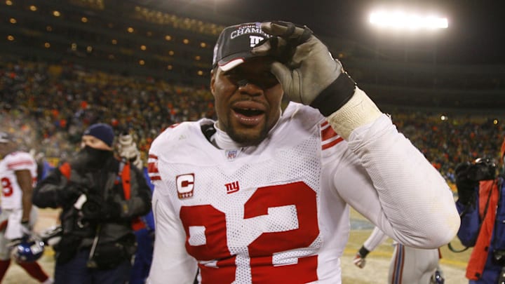Jan 20, 2008; Green Bay, WI, USA; New York Giants defensive end Michael Strahan (92) puts on his NFC Championship hat after beating gainst the Green Bay Packers during the NFC championship game at Lambeau Field. T 