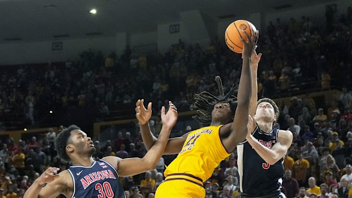 Feb 1, 2025; Tempe, Ariz., U.S.; Arizona Wildcats forward Tobe Awaka (30) and guard Anthony Dell'Orso (3) battle Arizona State Sun Devils forward Jayden Quaintance (21) for the rebound during a Big 12 menÕs basketball game at Desert Financial Arena.