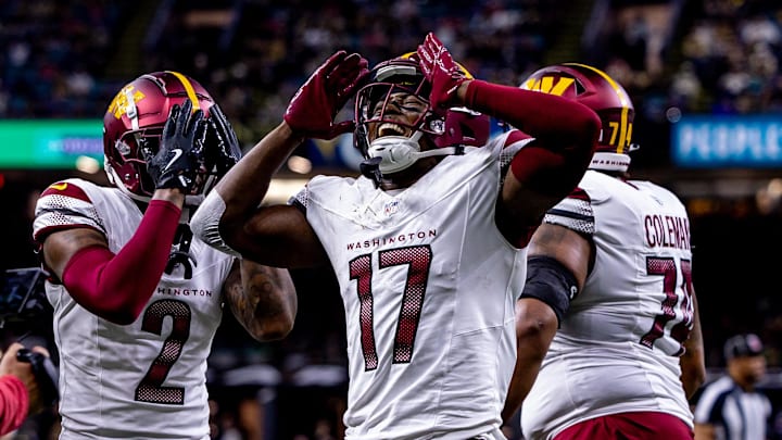 Dec 15, 2024; New Orleans, Louisiana, USA;  Washington Commanders wide receiver Terry McLaurin (17) reacts to scoring a touchdown against the New Orleans Saints during the first half at Caesars Superdome. 