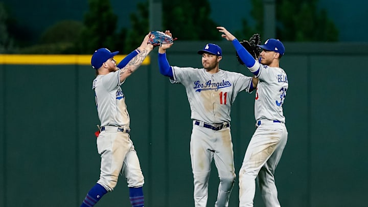 Jul 30, 2019; Denver, CO, USA; Los Angeles Dodgers left fielder Alex Verdugo (27) and center fielder A.J. Pollock (11) and right fielder Cody Bellinger (35) celebrate after the game against the Colorado Rockies at Coors Field. Mandatory Credit: Isaiah J. Downing-Imagn Images