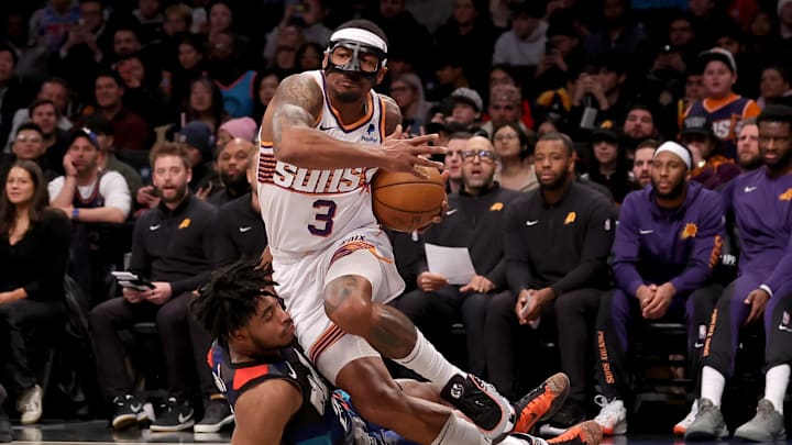 Jan 31, 2024; Brooklyn, New York, USA; Phoenix Suns guard Bradley Beal (3) is fouled by Brooklyn Nets guard Cam Thomas (24) as he drives to the basket during the first quarter at Barclays Center. Mandatory Credit: Brad Penner-Imagn Images