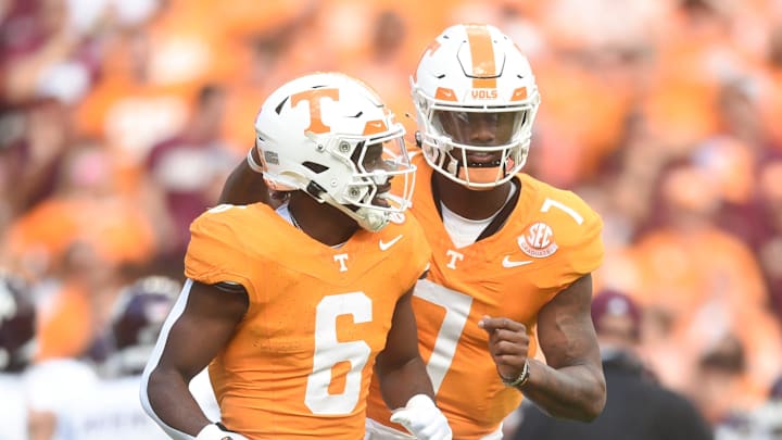 Tennessee quarterback Joe Milton III (7) and Tennessee running back Dylan Sampson (6) speak on the field during a football game between Tennessee and Texas A&M at Neyland Stadium in Knoxville, Tenn., on Saturday, Oct. 14, 2023.