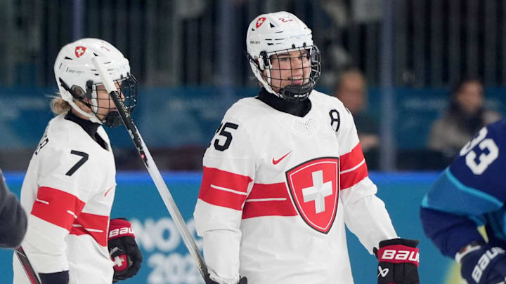 Feb 14, 2026; Milan, Italy; Alina Muller of Switzerland celebrates scoring their first goal with Lara Stalder of Switzerland against Finland  in a women's ice hockey quarterfinal during the Milano Cortina 2026 Olympic Winter Games at Milano Rho Ice Hockey Arena. Mandatory Credit: Amber Searls-Imagn Images