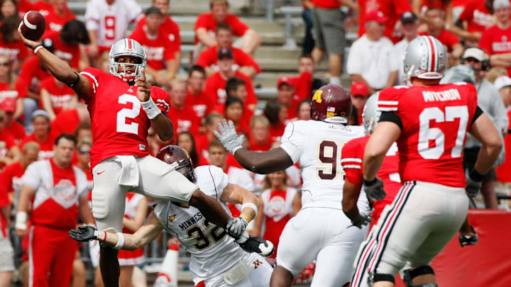 (NCL_OSU08MINN_LAURON 27SEP) Ohio State's Terrelle Pryor, 2, avoids a sack by Minnesota's Nathan Triplett, 32, in the second half of their game at The Ohio Stadium, September 27, 2008. (Dispatch photo by Neal C. Lauron)